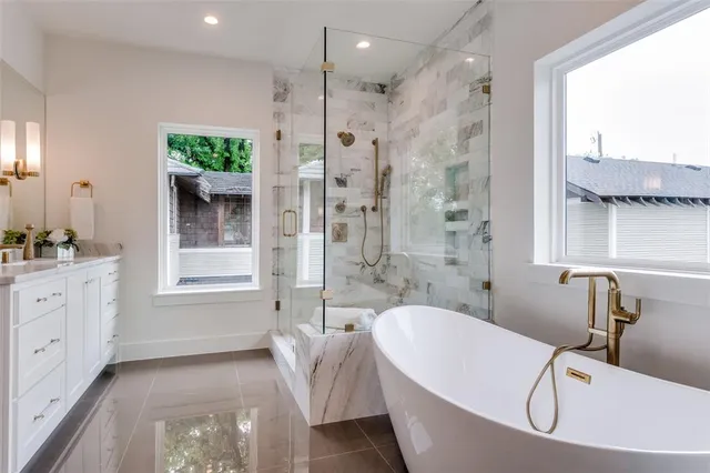 a bathroom with a tub sink and window