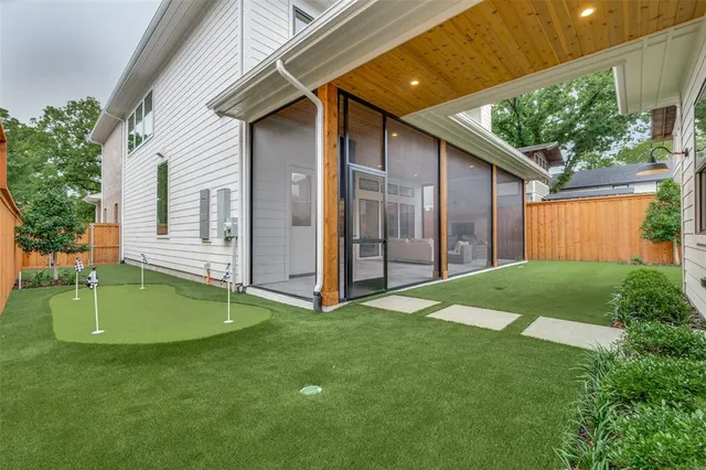 a backyard of a house with plants and a garden