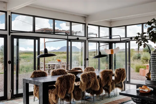 a view of a dining room with furniture window and outside view