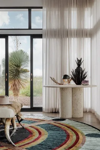 a bedroom with furniture and a window