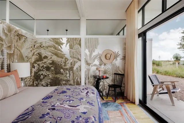 a bedroom with furniture and a window