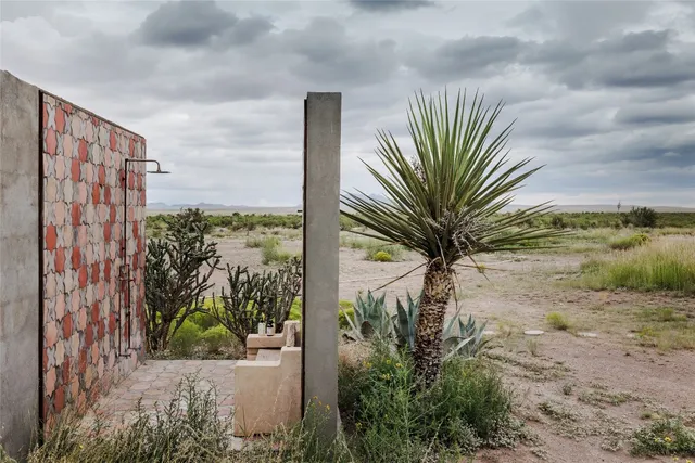 a view of a dining room with furniture and window