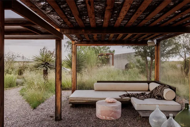a view of an outdoor sitting area with furniture