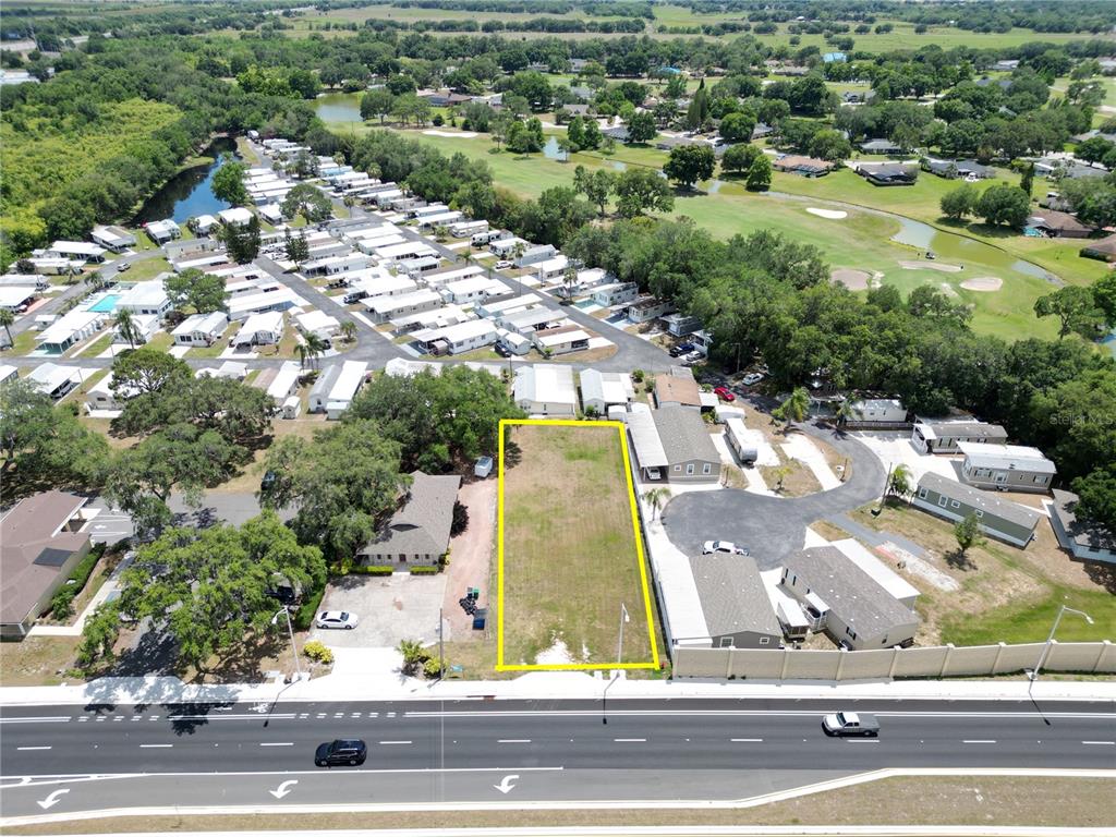 an aerial view of a house with yard