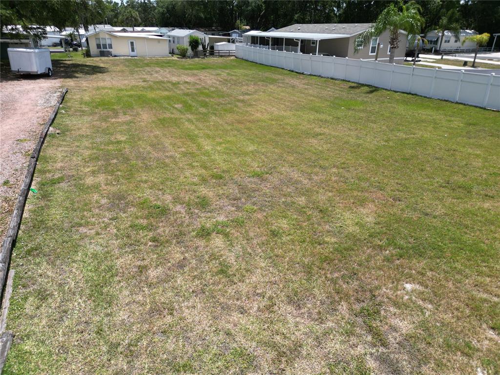 Dundee Road Dundee, FL 33838 - Photo 6 of 8 a view of a swimming pool with lawn chairs and plants