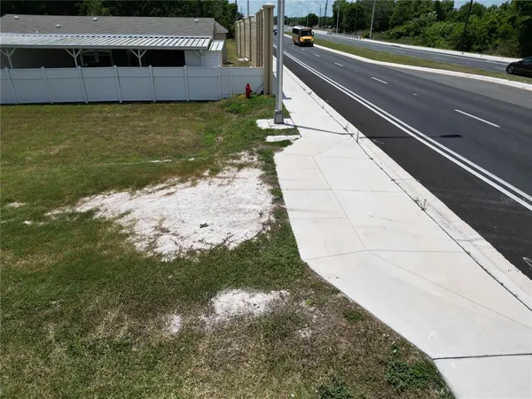 a view of a swimming pool with a yard
