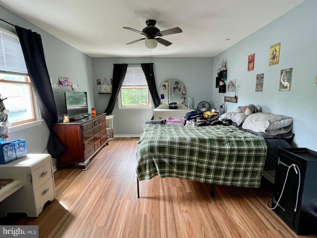 904-906 Main Avenue Croydon, PA 19021 - Photo 23 of 51 a bedroom with a bed and a chandelier