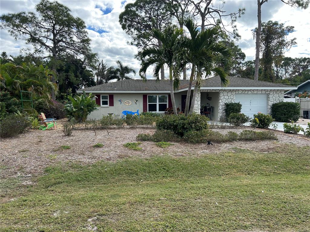 791 Linden Road Venice, FL 34293 - Photo 1 of 1 a front view of house with yard and trees around