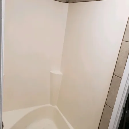 a close up of a white marble wall