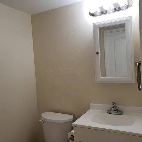 a bathroom with a toilet and sink