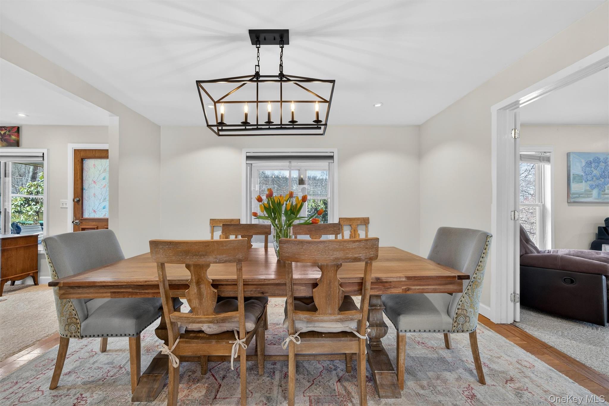 729 Mullock Road Port Jervis, NY 12771 - Photo 11 of 50 a view of a dining room with furniture a chandelier and wooden floor