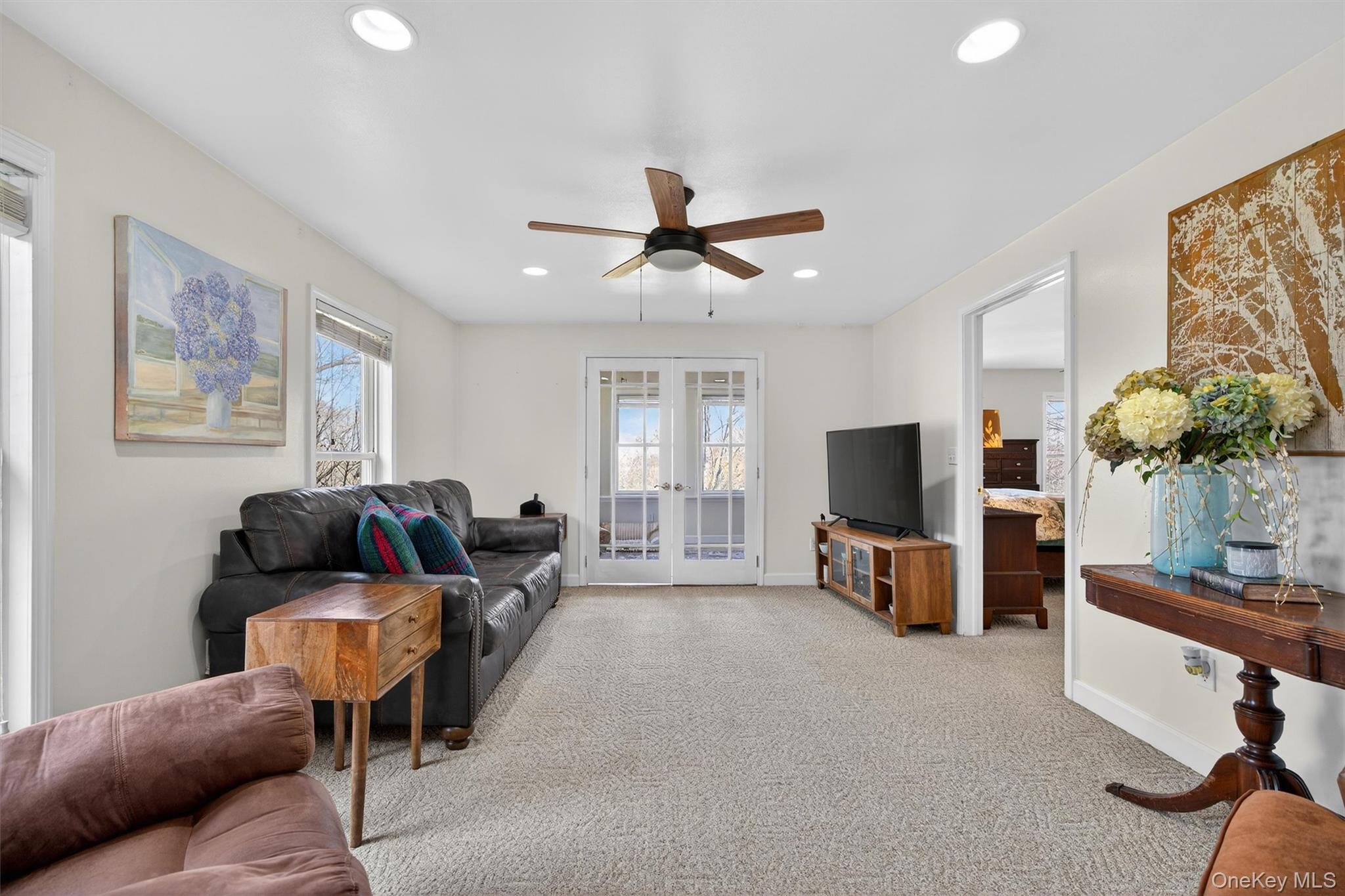 729 Mullock Road Port Jervis, NY 12771 - Photo 13 of 50 a living room with furniture and a flat screen tv