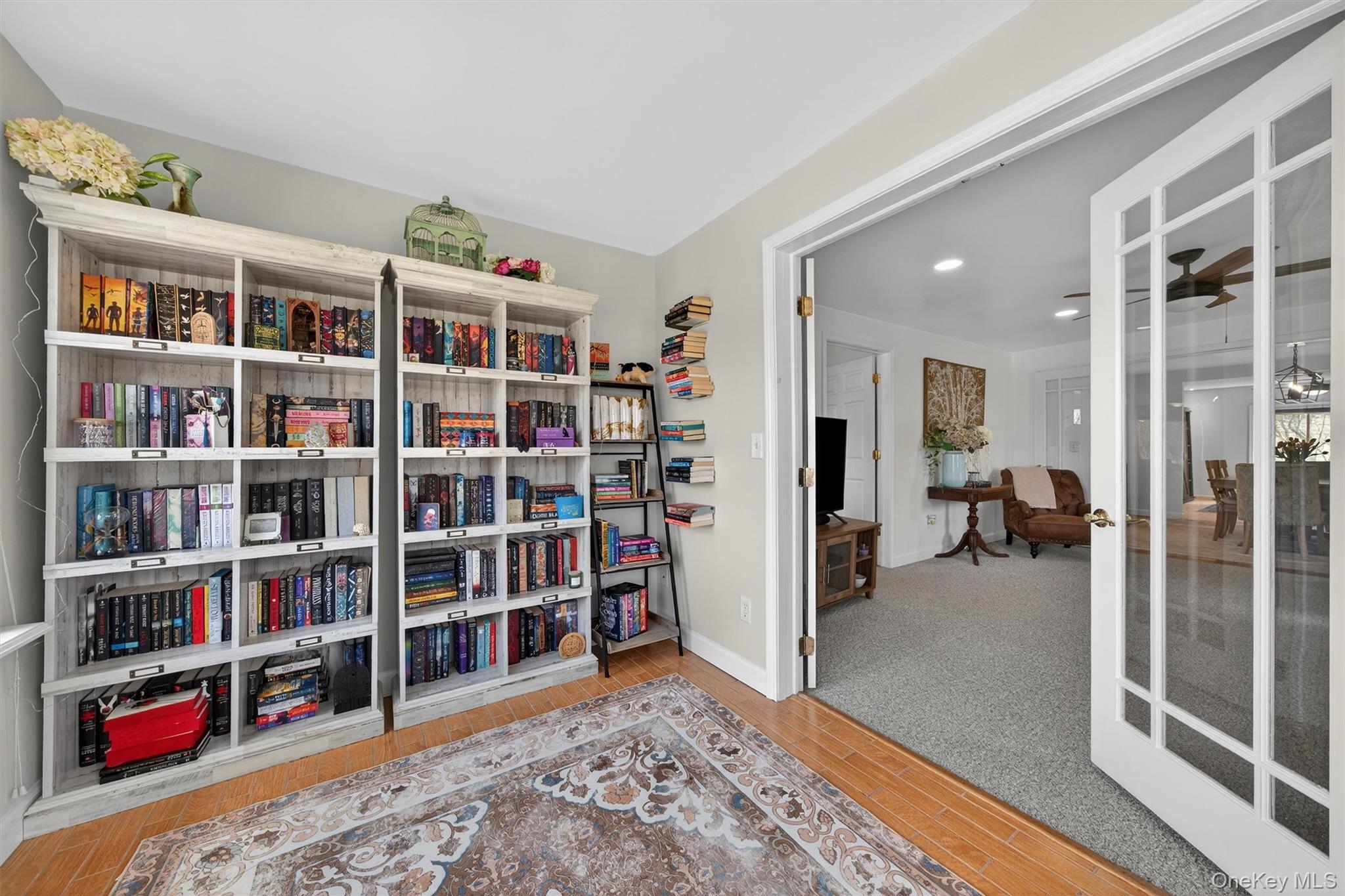 729 Mullock Road Port Jervis, NY 12771 - Photo 15 of 50 a living room with furniture and a book shelf