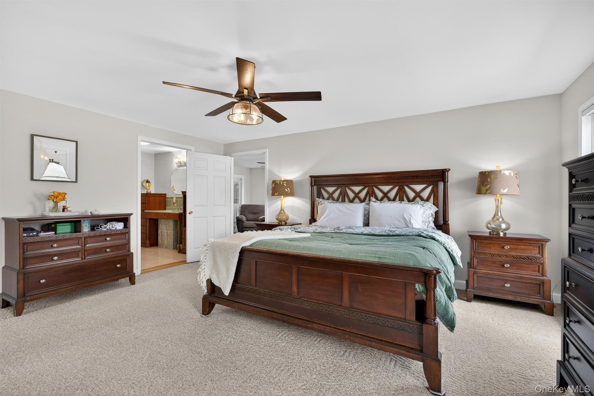 729 Mullock Road Port Jervis, NY 12771 - Photo 16 of 50 a bedroom with a bed and a chandelier