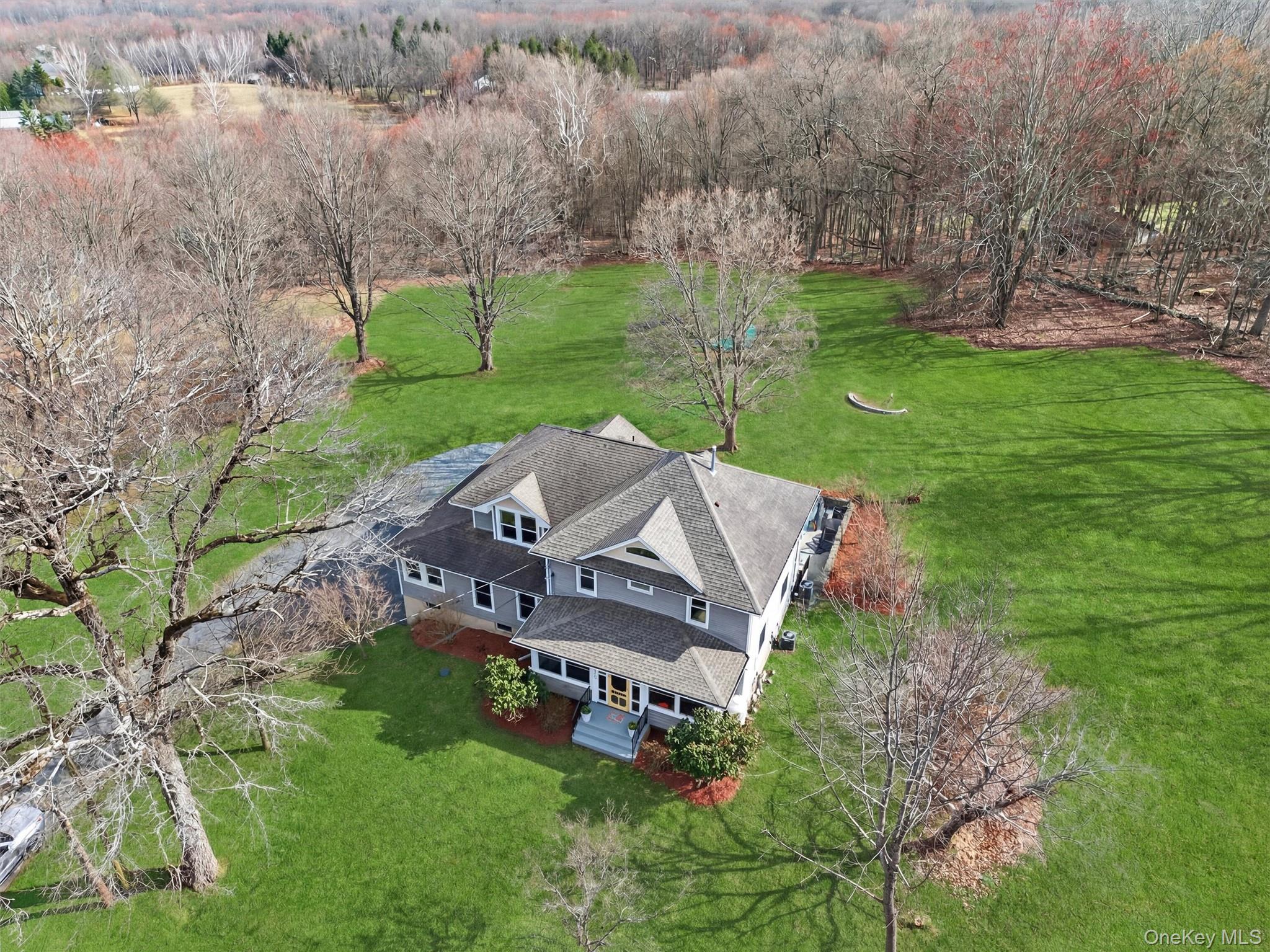 729 Mullock Road Port Jervis, NY 12771 - Photo 2 of 50 an aerial view of a house with garden