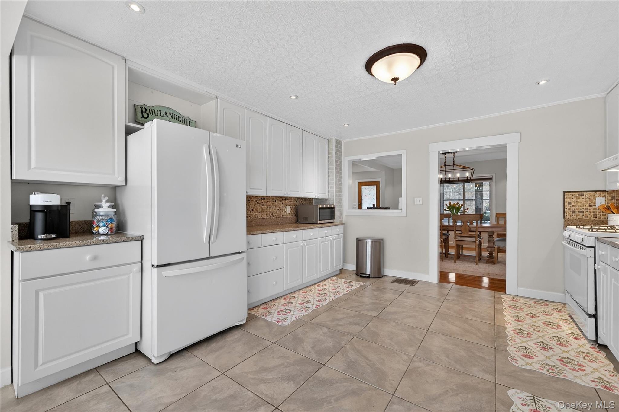 729 Mullock Road Port Jervis, NY 12771 - Photo 24 of 50 a kitchen with cabinets and refrigerator