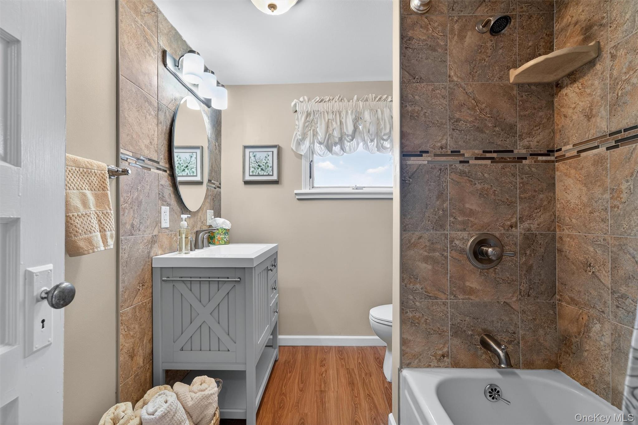 729 Mullock Road Port Jervis, NY 12771 - Photo 35 of 50 a bathroom with a sink a toilet a window and shower