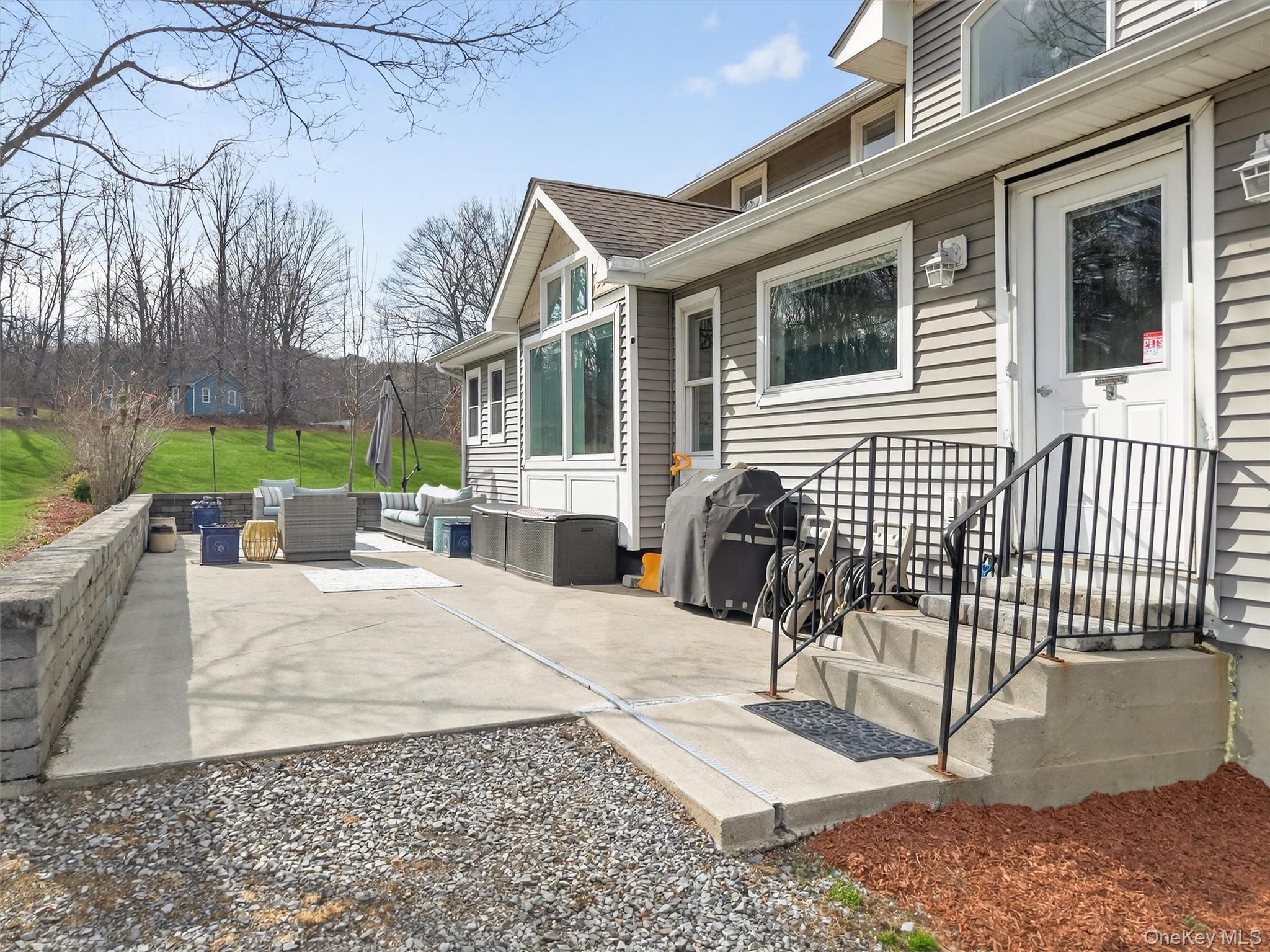 729 Mullock Road Port Jervis, NY 12771 - Photo 39 of 50 a view of a house with a patio