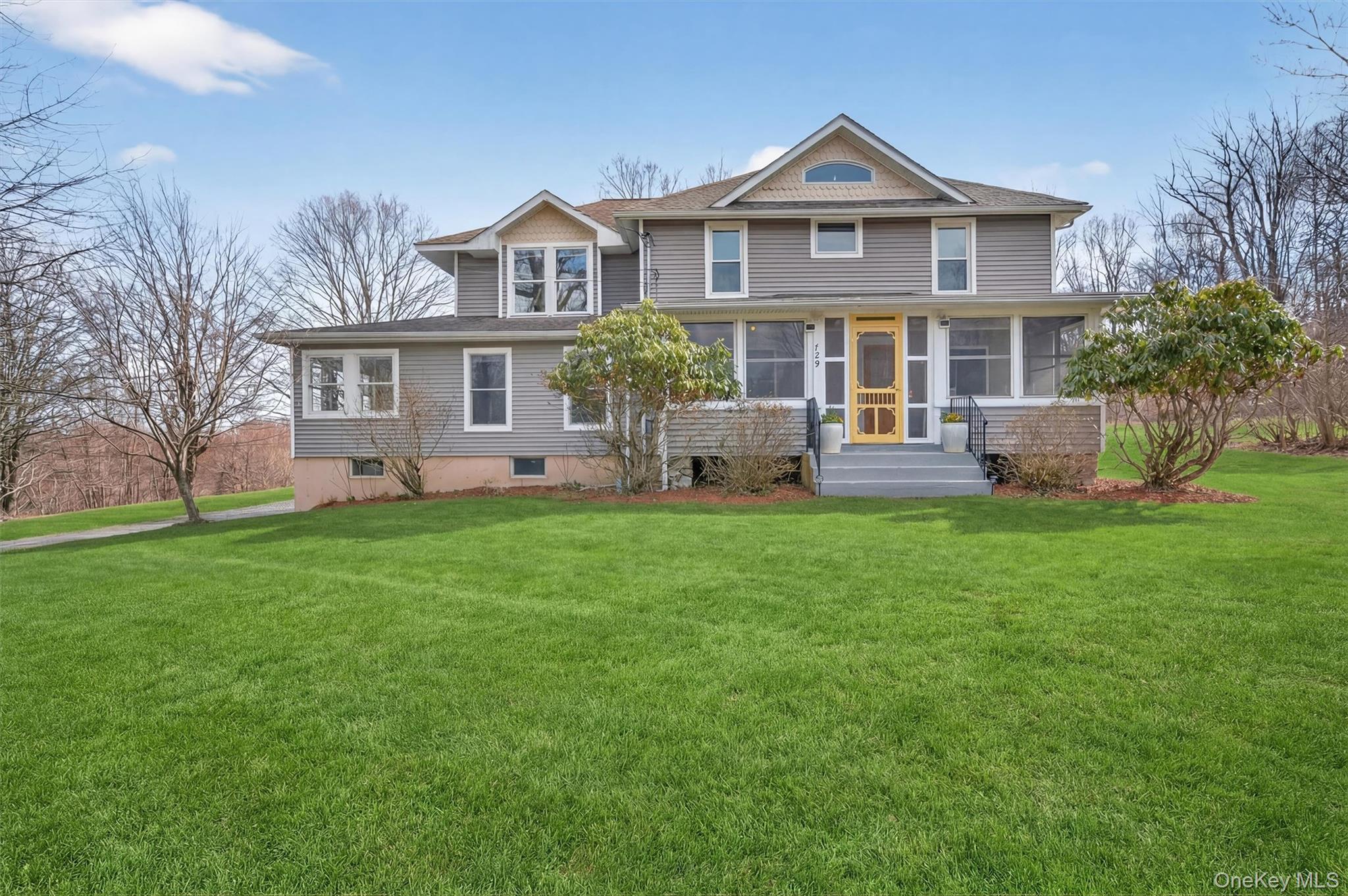729 Mullock Road Port Jervis, NY 12771 - Photo 4 of 50 a view of house with a big yard and large trees