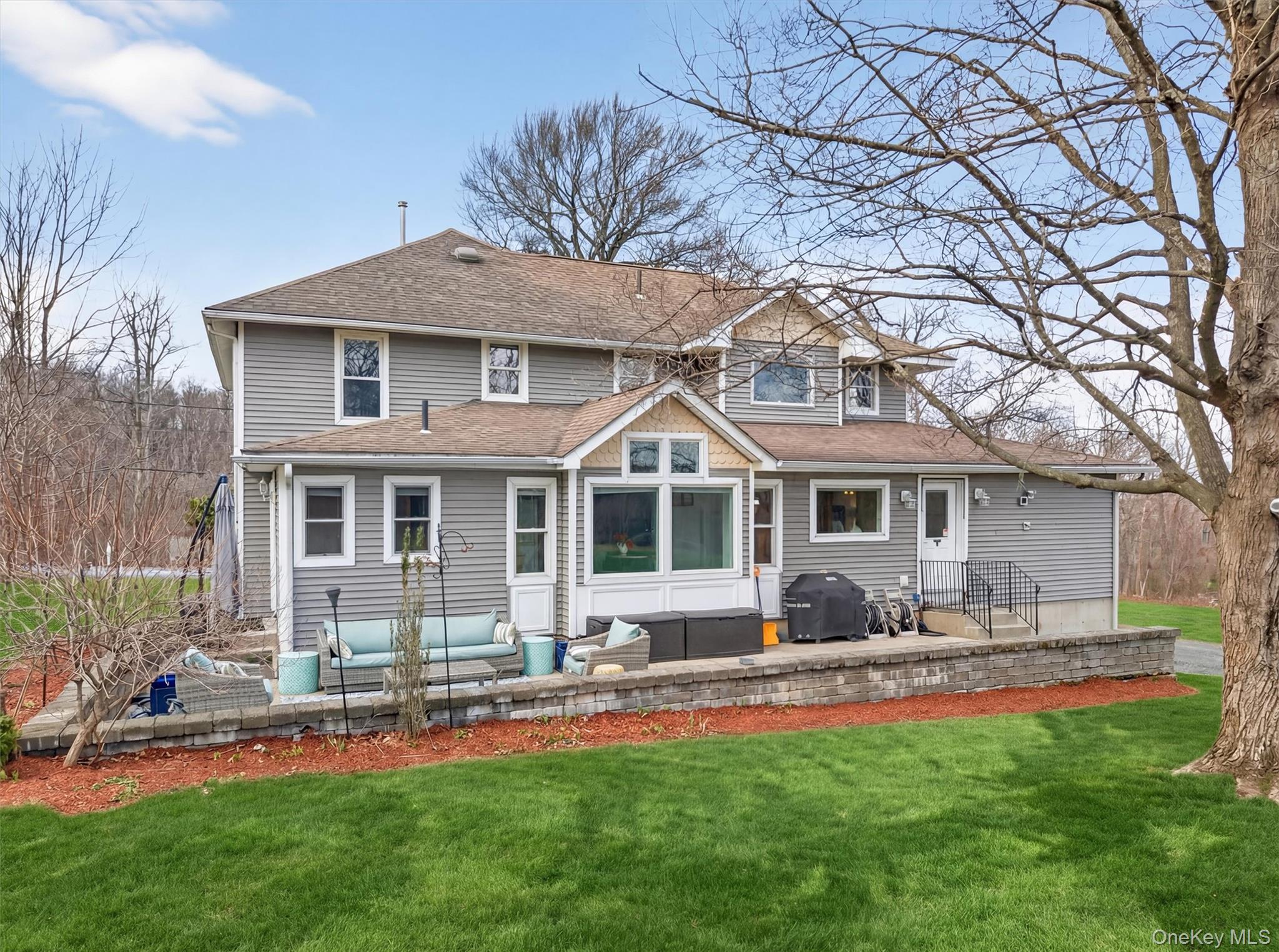 729 Mullock Road Port Jervis, NY 12771 - Photo 41 of 50 a front view of a house with a yard table and chairs