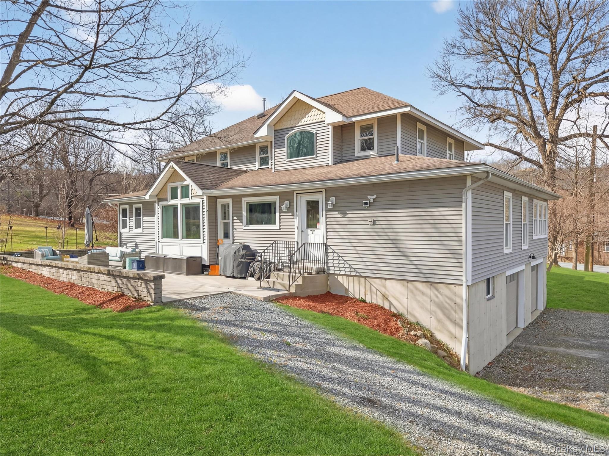 729 Mullock Road Port Jervis, NY 12771 - Photo 46 of 50 a front view of a house with garden and porch