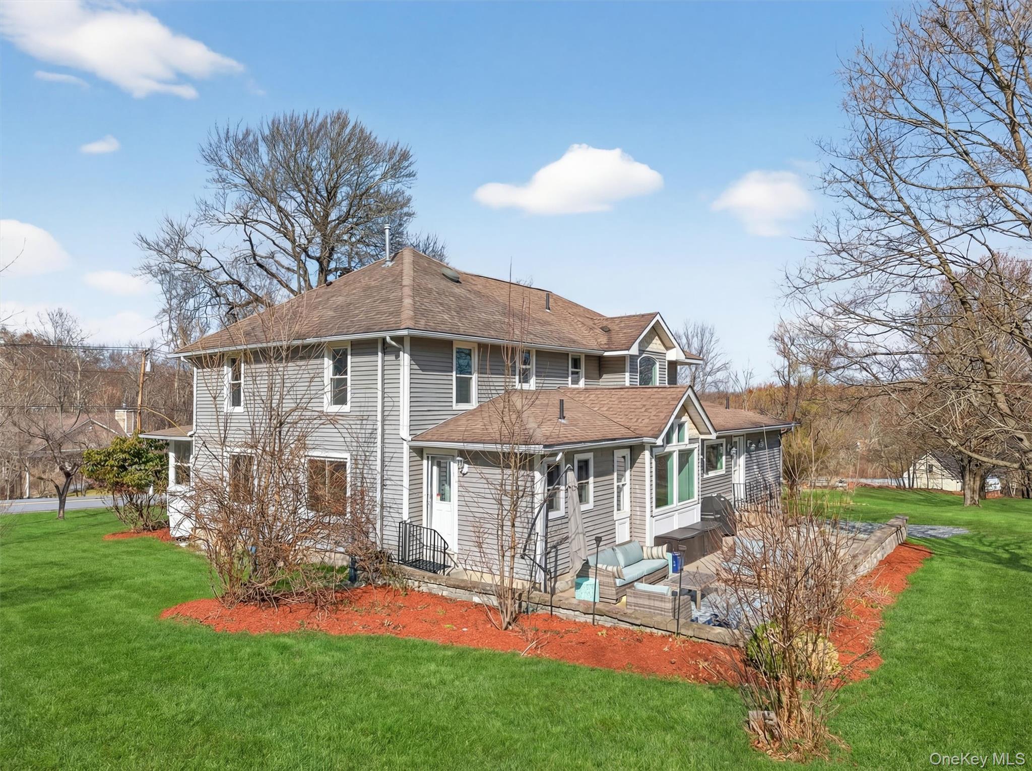 729 Mullock Road Port Jervis, NY 12771 - Photo 47 of 50 a front view of a house with a yard table and chairs