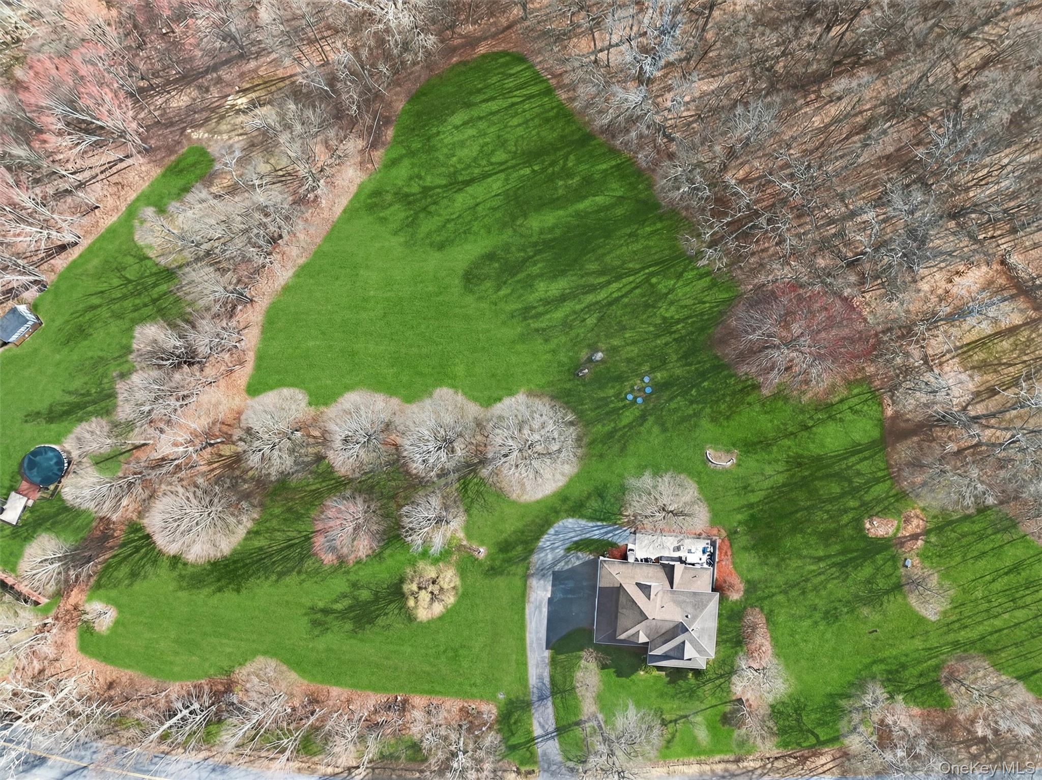 729 Mullock Road Port Jervis, NY 12771 - Photo 50 of 50 a aerial view of a house with a yard and large trees