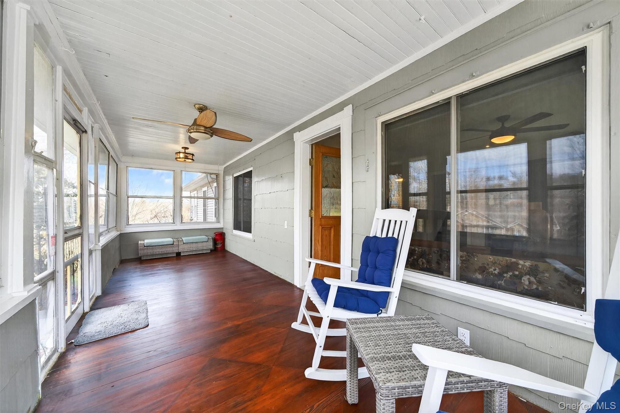 729 Mullock Road Port Jervis, NY 12771 - Photo 7 of 50 a view of a livingroom with furniture wooden floor and windows