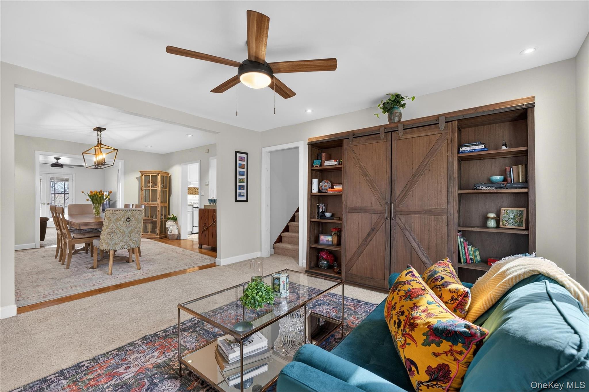 729 Mullock Road Port Jervis, NY 12771 - Photo 10 of 50 a living room with furniture and a book shelf