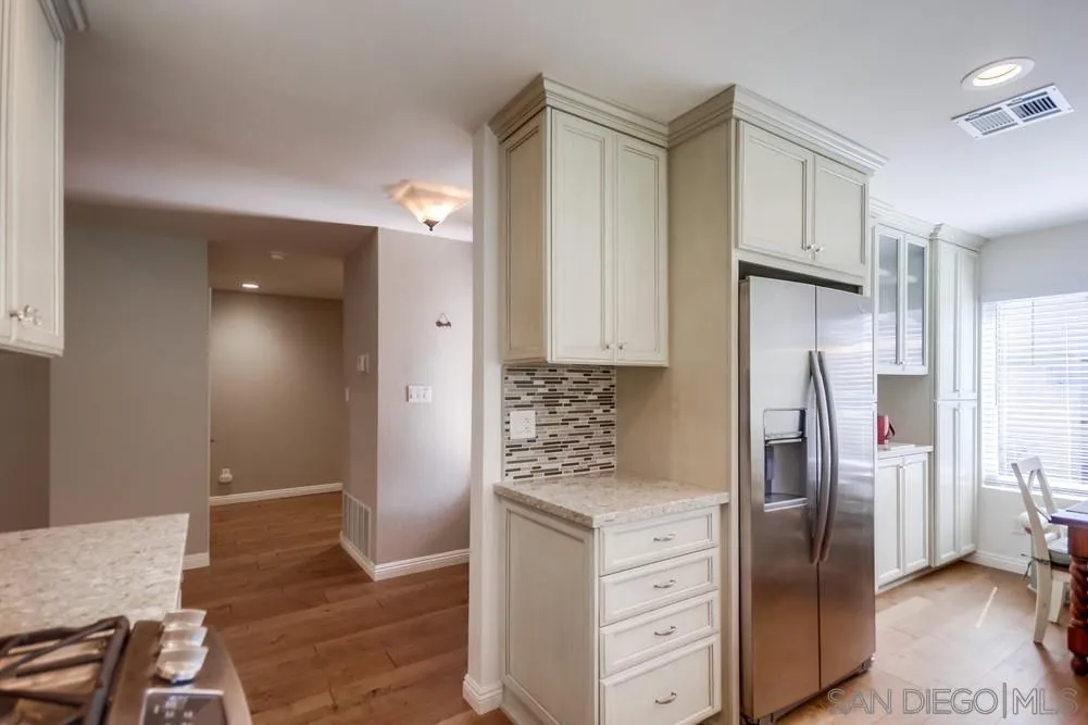 3797 Fallon Circle San Diego, CA 92130 - Photo 17 of 37 a kitchen with stainless steel appliances granite countertop a refrigerator and a stove