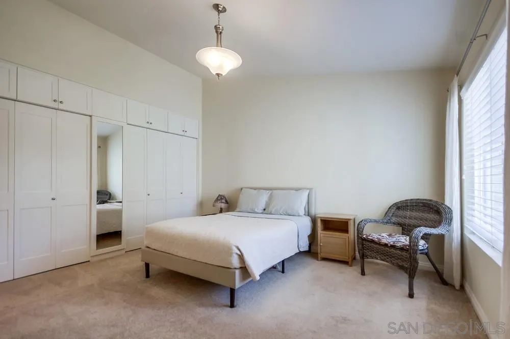 3797 Fallon Circle San Diego, CA 92130 - Photo 22 of 37 a bedroom with a bed and a window