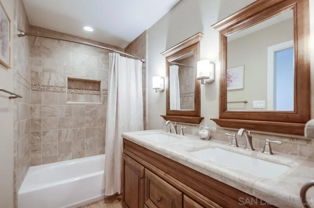 3797 Fallon Circle San Diego, CA 92130 - Photo 24 of 37 a bathroom with a granite countertop sink mirror and a bath tub