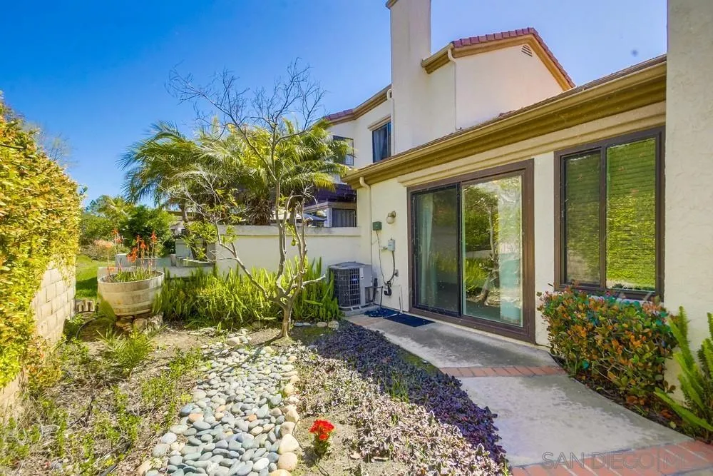 3797 Fallon Circle San Diego, CA 92130 - Photo 26 of 37 a front view of a house with garden