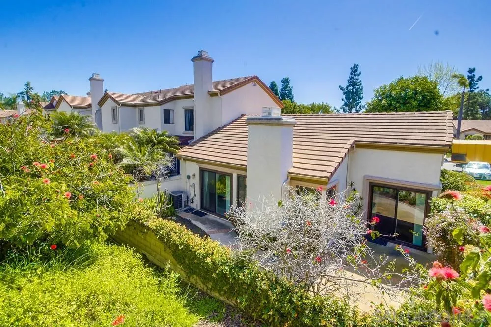 3797 Fallon Circle San Diego, CA 92130 - Photo 31 of 37 a front view of a house with a yard