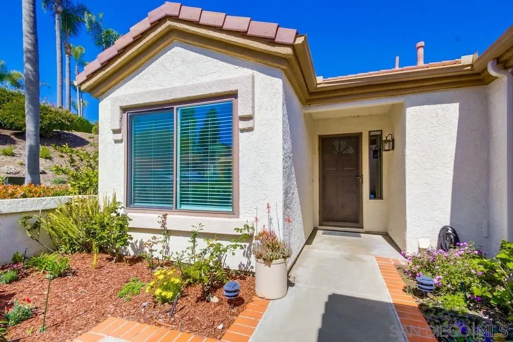3797 Fallon Circle San Diego, CA 92130 - Photo 4 of 37 a front view of a house with a yard