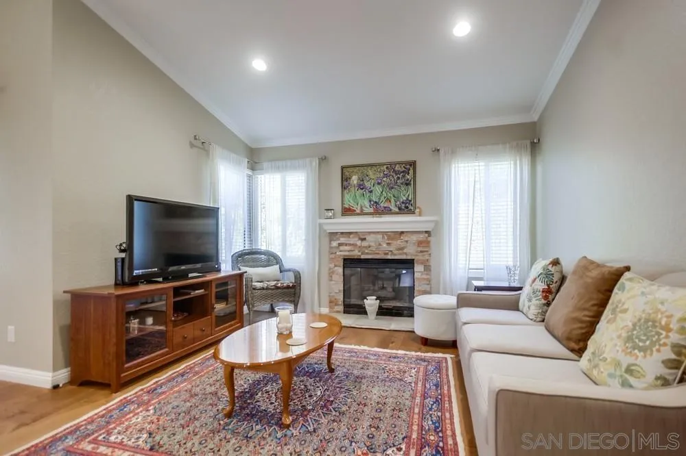 3797 Fallon Circle San Diego, CA 92130 - Photo 6 of 37 a living room with furniture and a flat screen tv