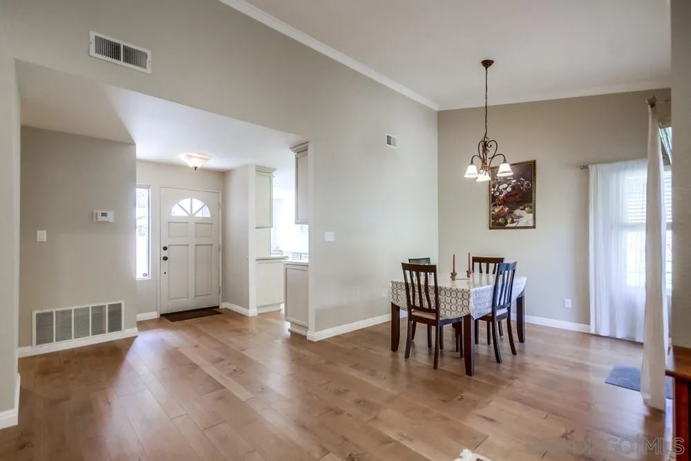 3797 Fallon Circle San Diego, CA 92130 - Photo 7 of 37 a view of a dining room with furniture window and wooden floor
