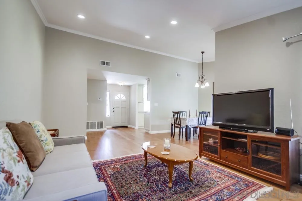 3797 Fallon Circle San Diego, CA 92130 - Photo 10 of 37 a living room with furniture and a flat screen tv