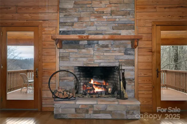 a fireplace with a clock on wall