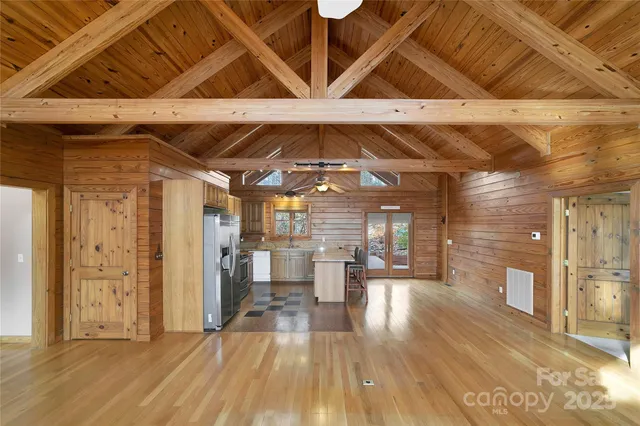 a view of a room with wooden floor