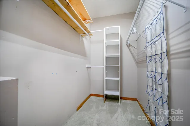 a view of an empty room with stairs