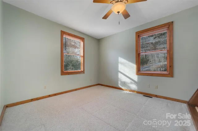 a bathroom with a toilet a sink and a mirror