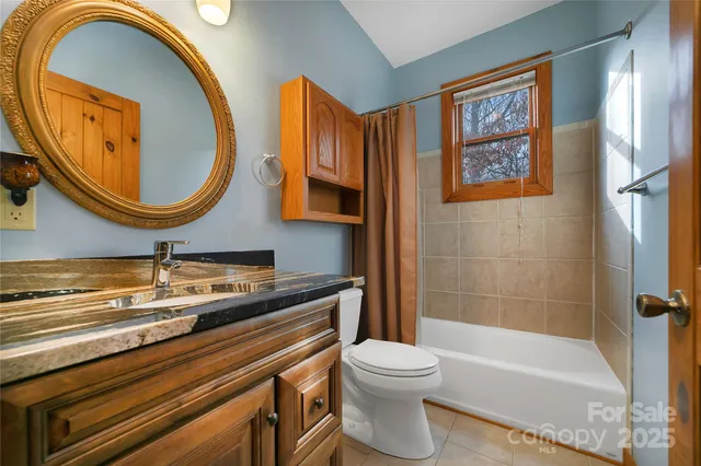 a view of an entryway wooden floor and an entrance