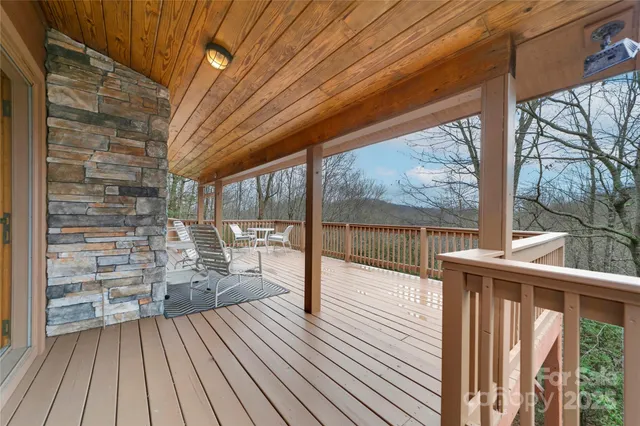 a view of a balcony with wooden floor