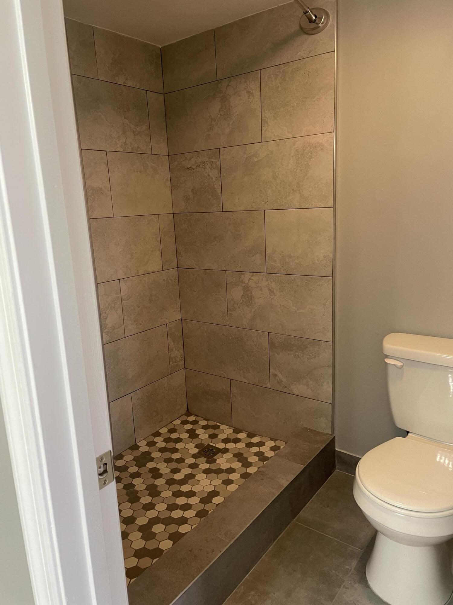 2800 Palmwood Terrace, Unit P221 Boca Raton, FL 33431 - Photo 12 of 16 a bathroom with a sink and a toilet
