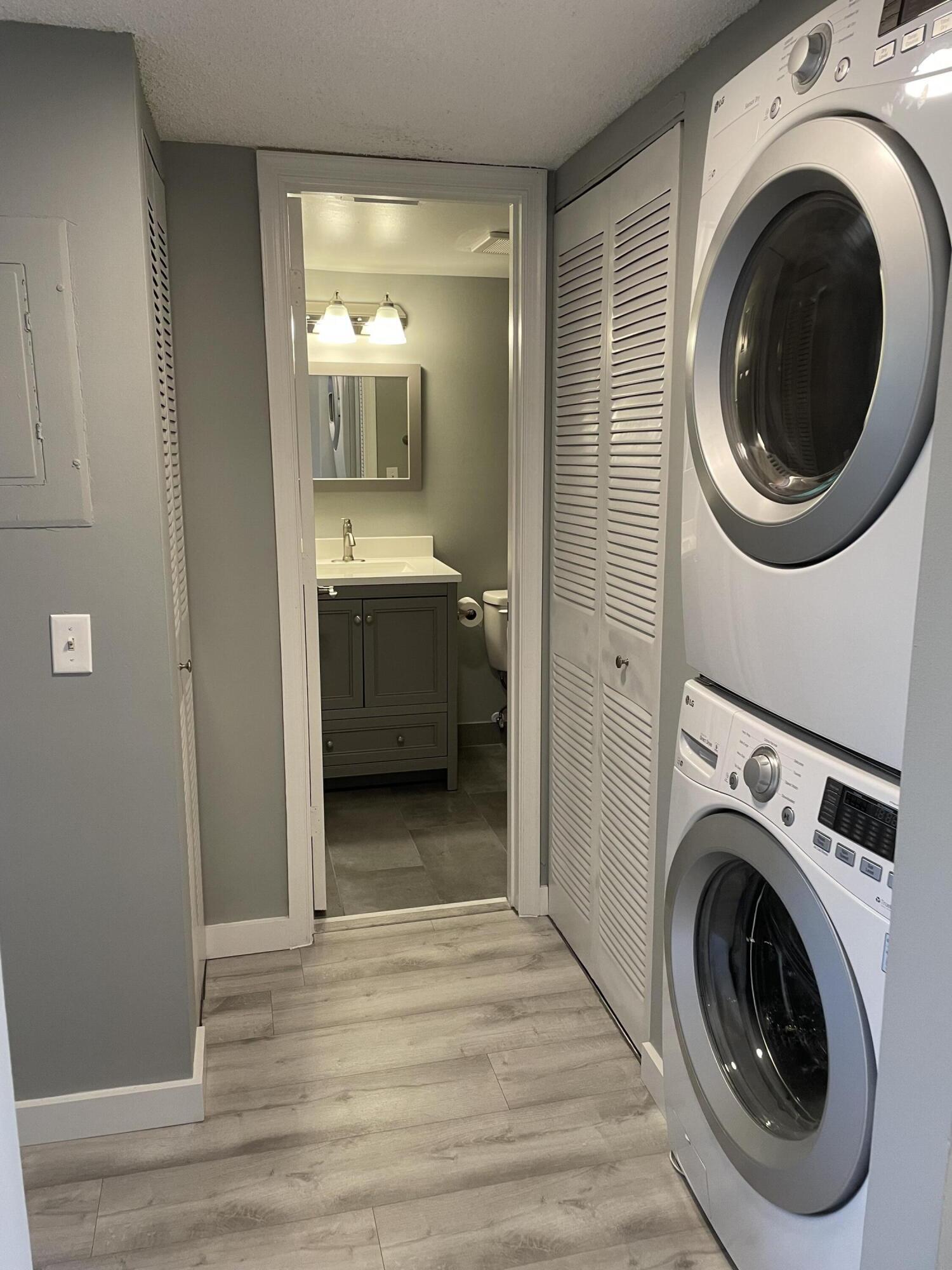 2800 Palmwood Terrace, Unit P221 Boca Raton, FL 33431 - Photo 13 of 16 a view of a hallway with washer and dryer