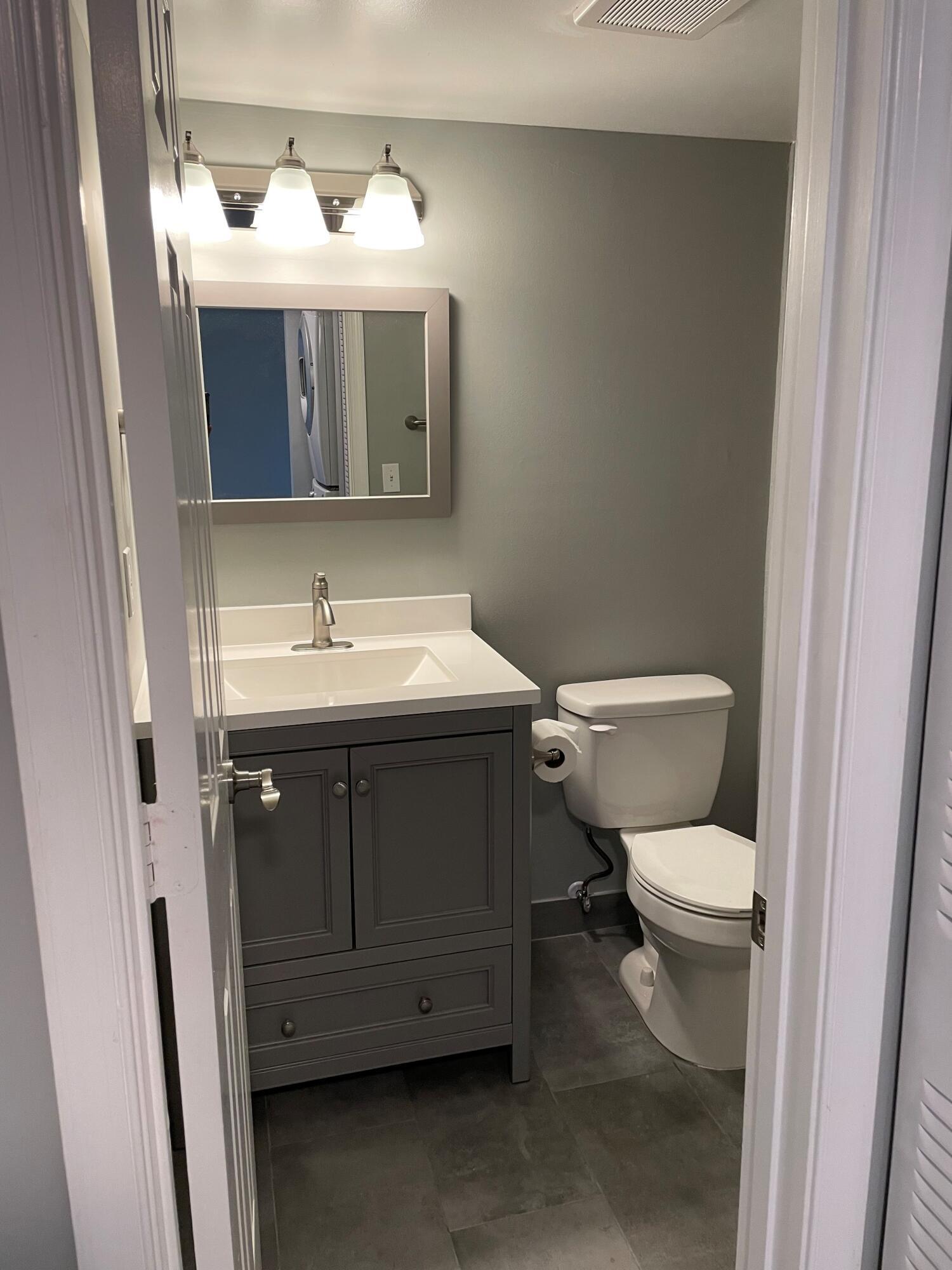 2800 Palmwood Terrace, Unit P221 Boca Raton, FL 33431 - Photo 15 of 16 a bathroom with a sink and a toilet