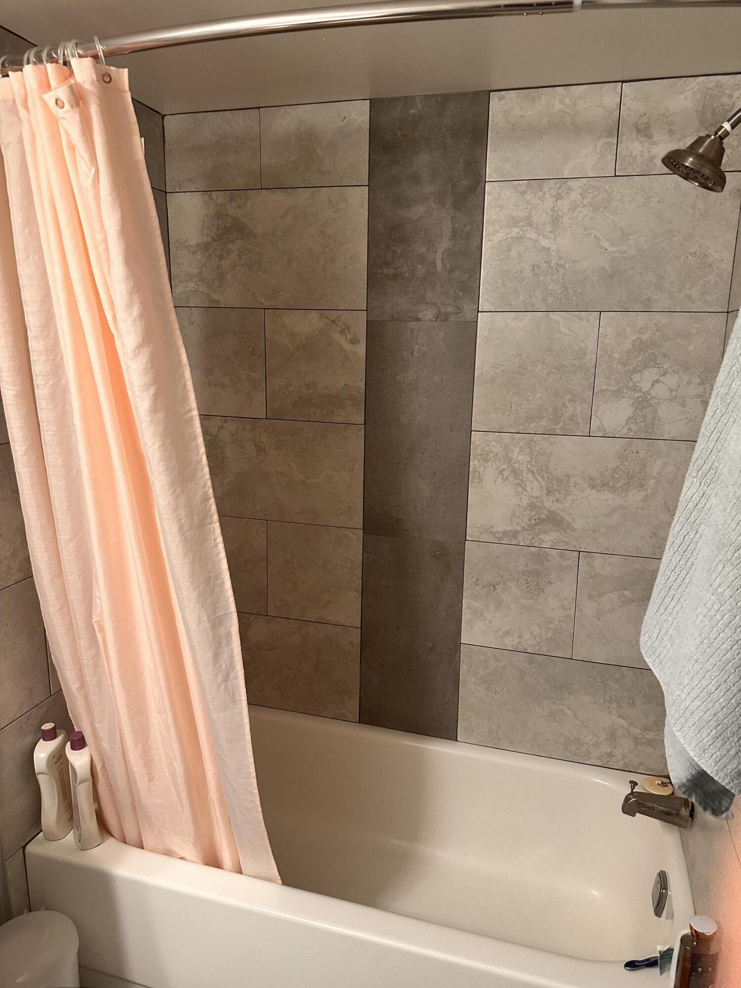 2800 Palmwood Terrace, Unit P221 Boca Raton, FL 33431 - Photo 16 of 16 a bathroom with a bathtub