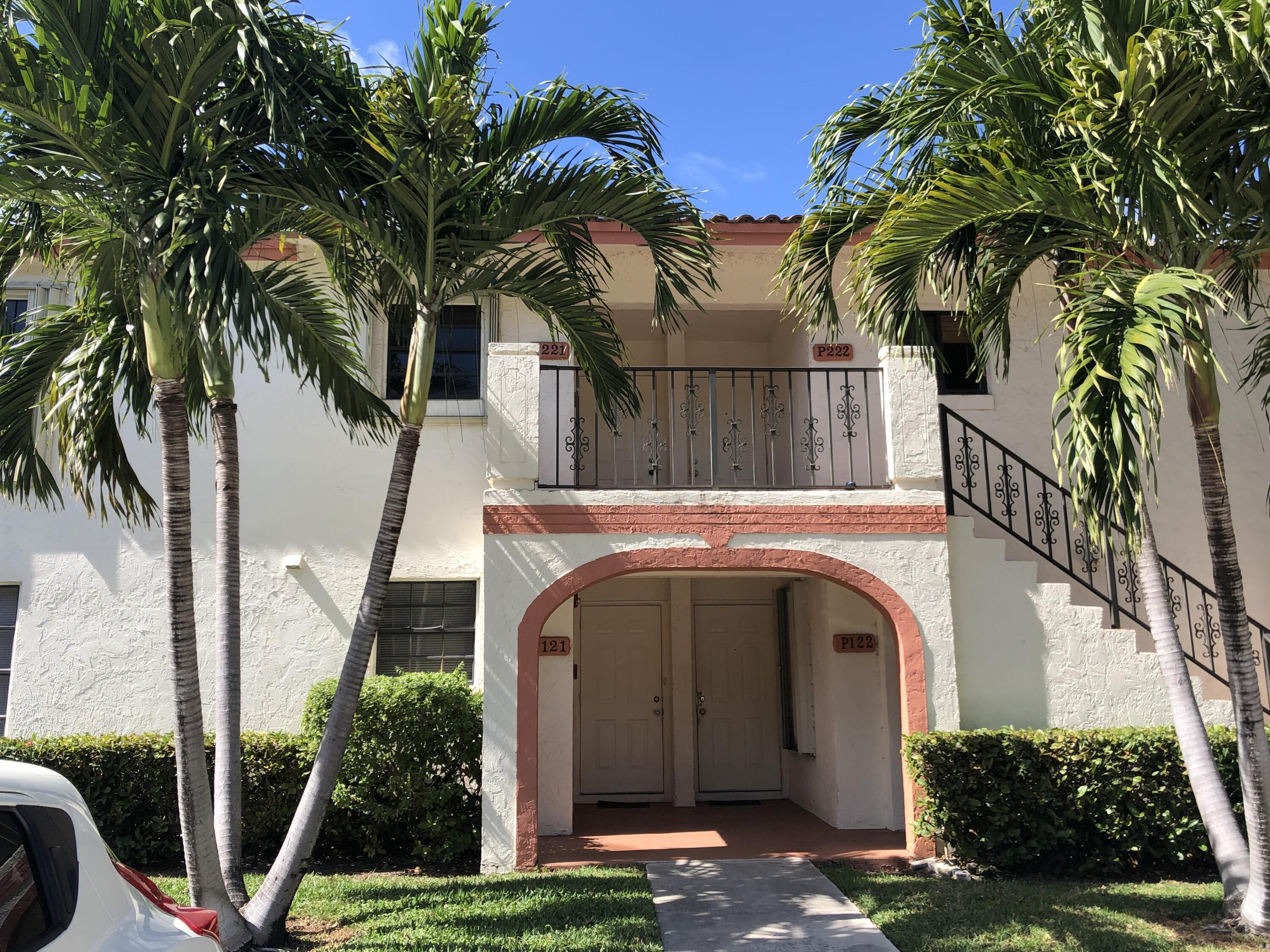 2800 Palmwood Terrace, Unit P221 Boca Raton, FL 33431 - Photo 2 of 16 a view of a small house with palm trees