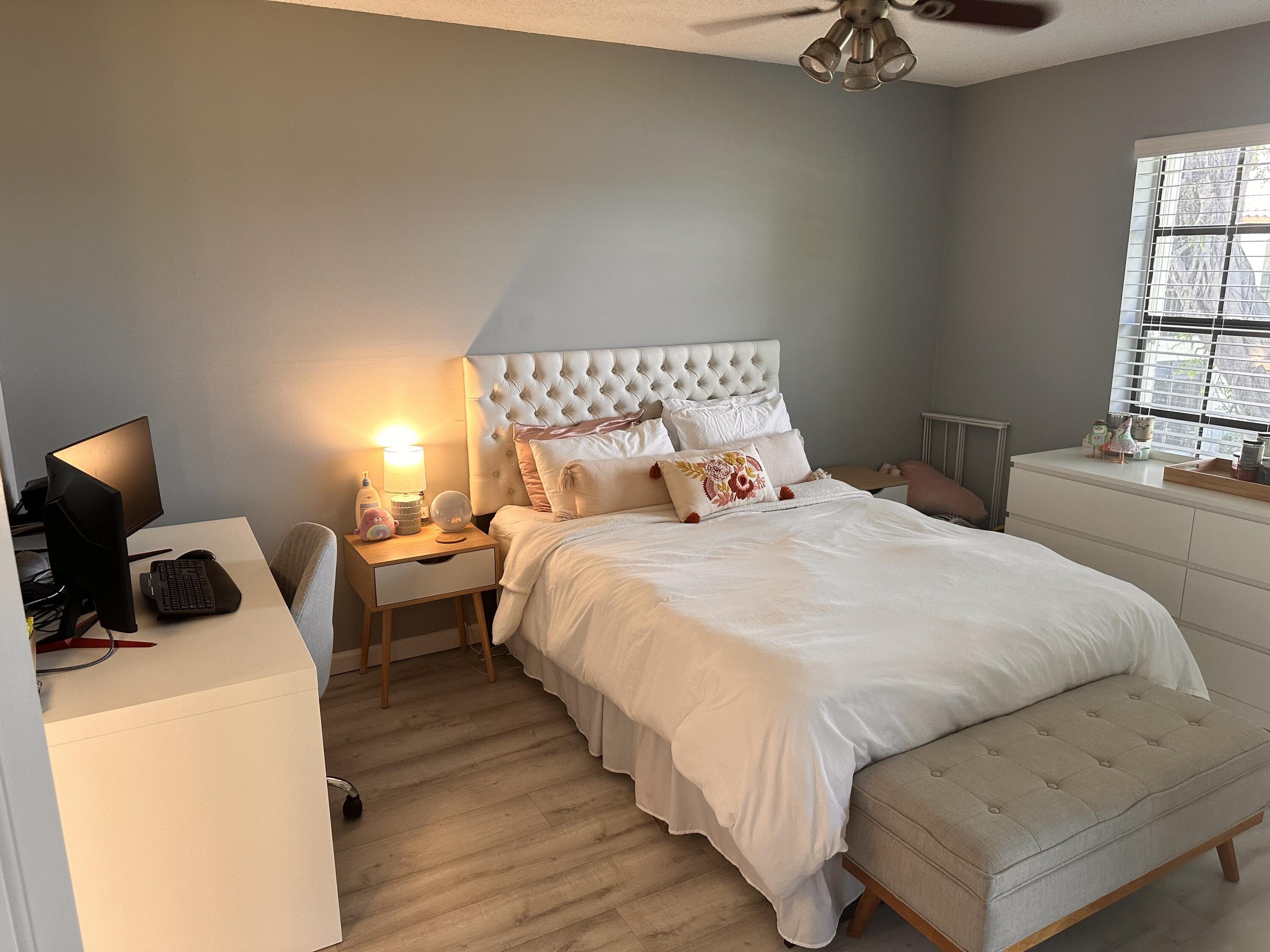 2800 Palmwood Terrace, Unit P221 Boca Raton, FL 33431 - Photo 8 of 16 a bedroom with a bed and a tv